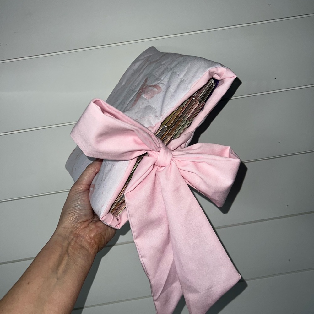 Bible or book cover with pink bows